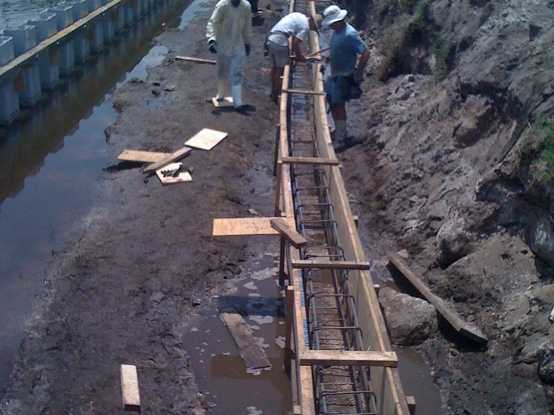 Seawall construction using the continuous dead-man pour method
