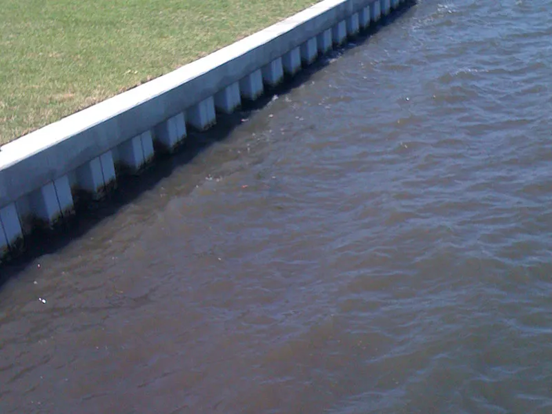 Completed seawall with fresh sod restored to the waterline